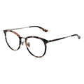 A pair of oval eyeglasses with a tortoise patterned frame and transparent lenses, featuring a metallic browline.