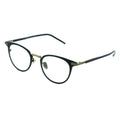 A pair of oval eyeglasses with a sleek frame design, featuring a blend of black and gold metal.