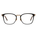 A pair of square eyeglasses with a black frame, gold temples.