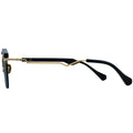 Black and gold eyeglasses on a white background