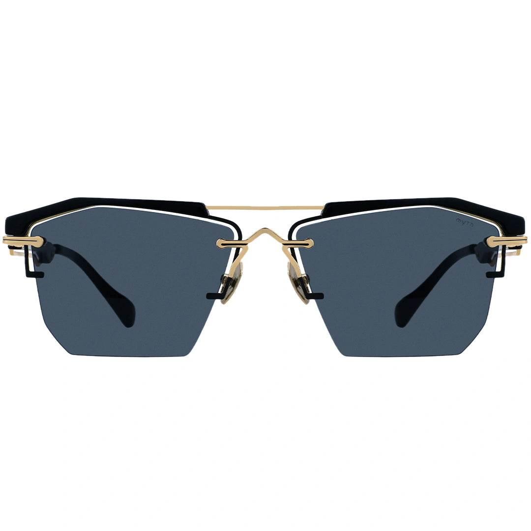 Sunglasses with black lenses and gold frames on a white background