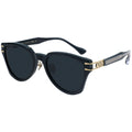 Black sunglasses with gold accents on a white background