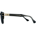 Black and gold sunglasses on a white background