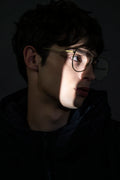 A model wears AIKTON eyeglasses