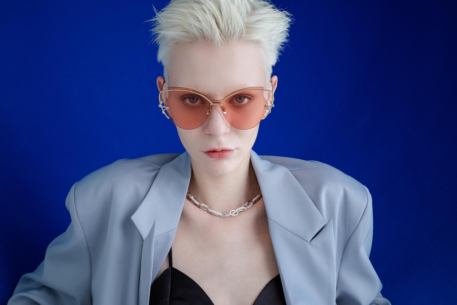 MYTH Greece retro cat eye sunglasses. Womens laides pink retro 70s butterfly shape sunglasses with snake shape rim decoration. model in thin gold metal frame elegant vibe