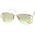 Gold-framed sunglasses with green-tinted lenses on a white background
