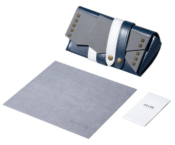 Blue clutch bag with gold studs on a white background