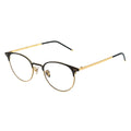 Black and gold eyeglasses on a white background