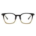 Black and gold eyeglasses on a white background