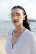 woman wearing μορφώ  square sunglasses light tinted gradient lens 