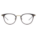 A pair of oval eyeglasses with a sleek frame design, featuring a blend of brown and gold metal.