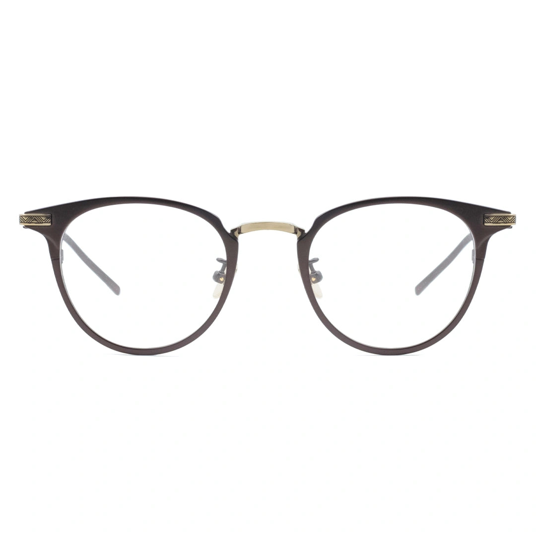A pair of oval eyeglasses with a sleek frame design, featuring a blend of brown and gold metal.