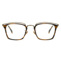 Front view of angular tortoiseshell glasses with an antique gold layered metal browline.