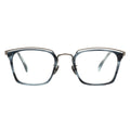 Front view of angular translucent blue-grey glasses with a layered silver metal browline.