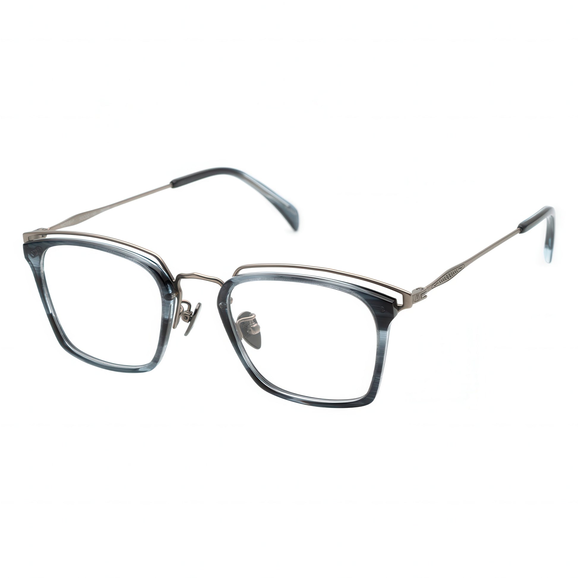 Three-quarter view of angular translucent blue-grey glasses with a layered silver metal browline.