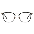 Front view of angular black and gold combination frame eyeglasses.