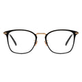 A pair of square eyeglasses with a black frame, gold temples.
