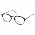 A pair of oval eyeglasses with a black frame.