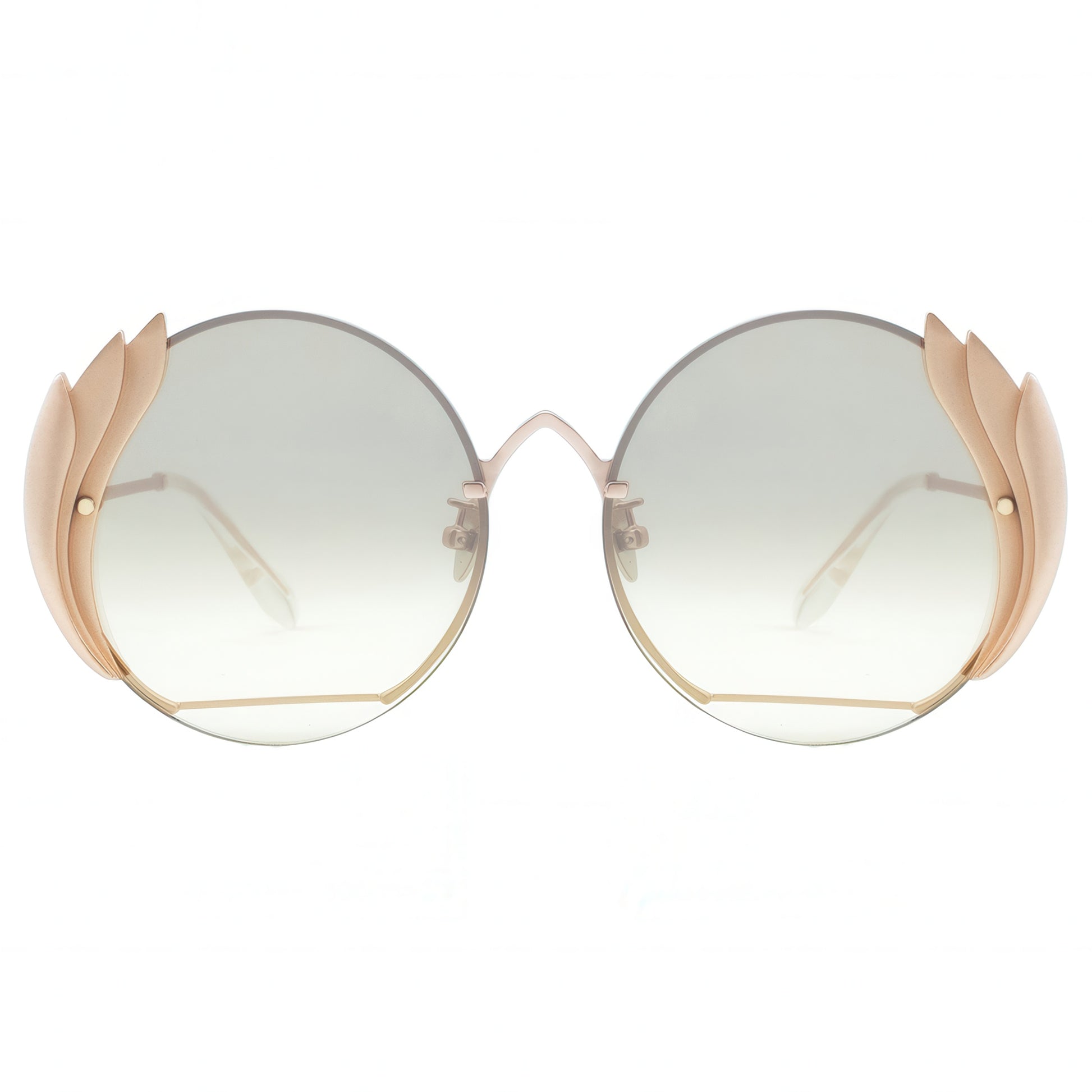 Sunglasses with gold frame and gradient lenses on a white background