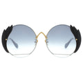 Sunglasses with black wing-like extensions on a white background