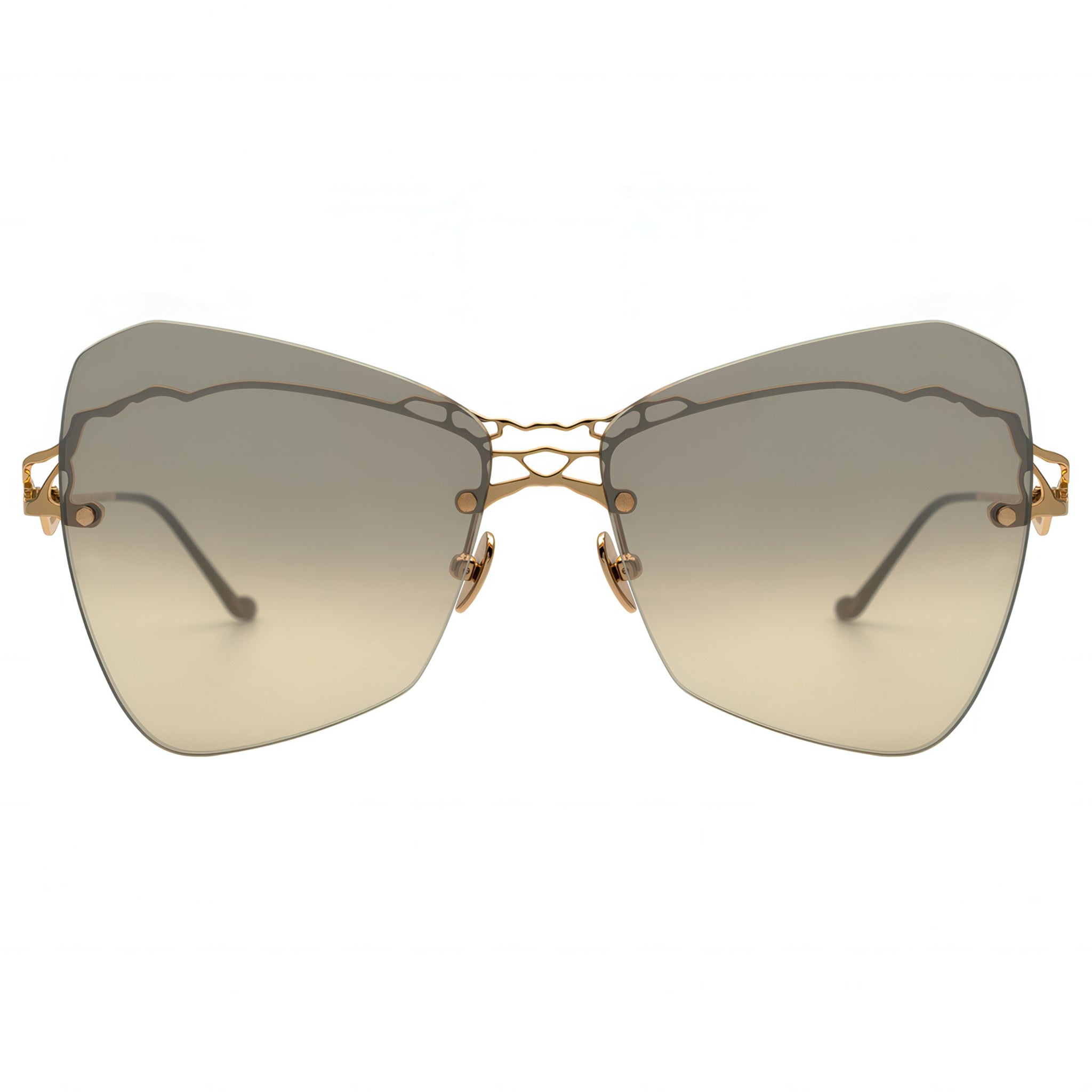 Sunglasses with gold frame and gradient lenses on a white background