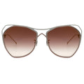 Sunglasses with gradient lenses and metallic frame on a white background