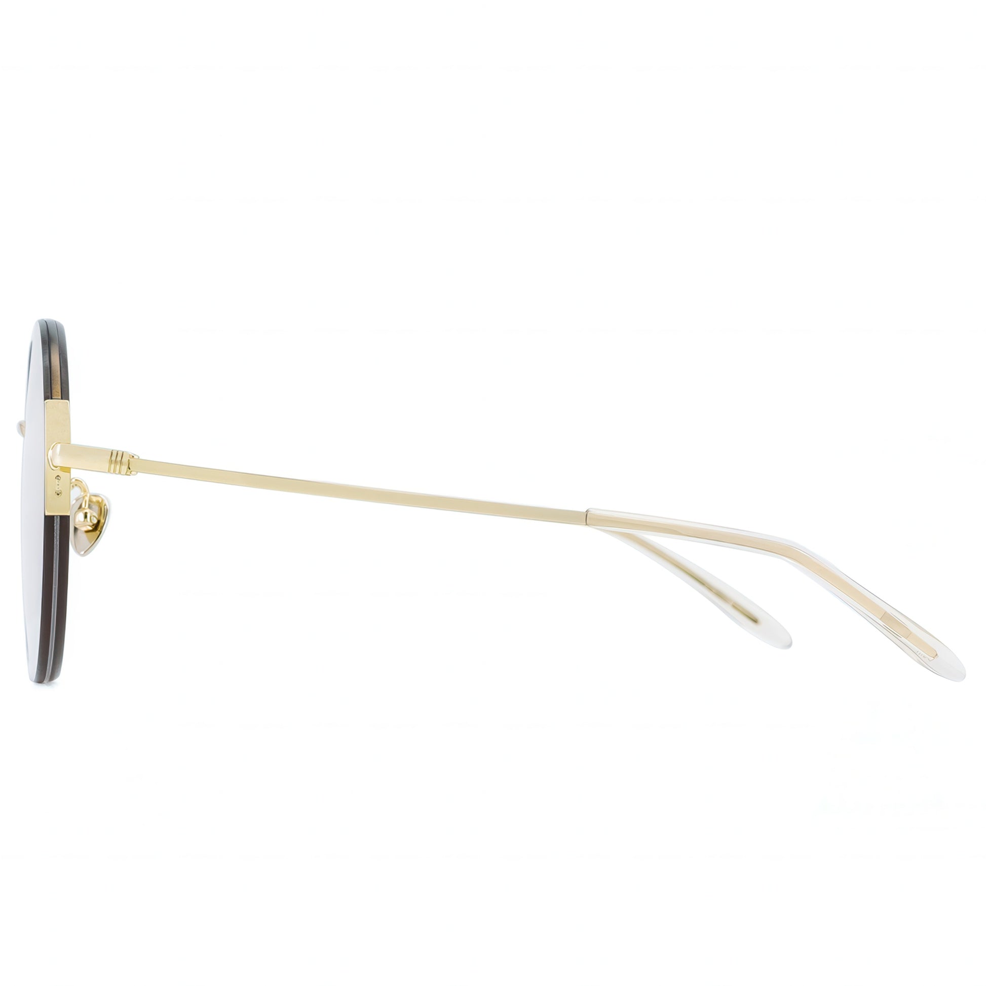 Sunglasses with gold frame and black lenses on a white background