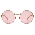 Round sunglasses with pink lenses and gold frames on a white background
