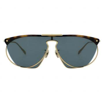 Sunglasses with gold frame and tortoiseshell accents on a white background