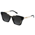 Black sunglasses with gold frames on a white background