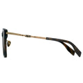 Sunglasses with a gold frame and black arms on a white background