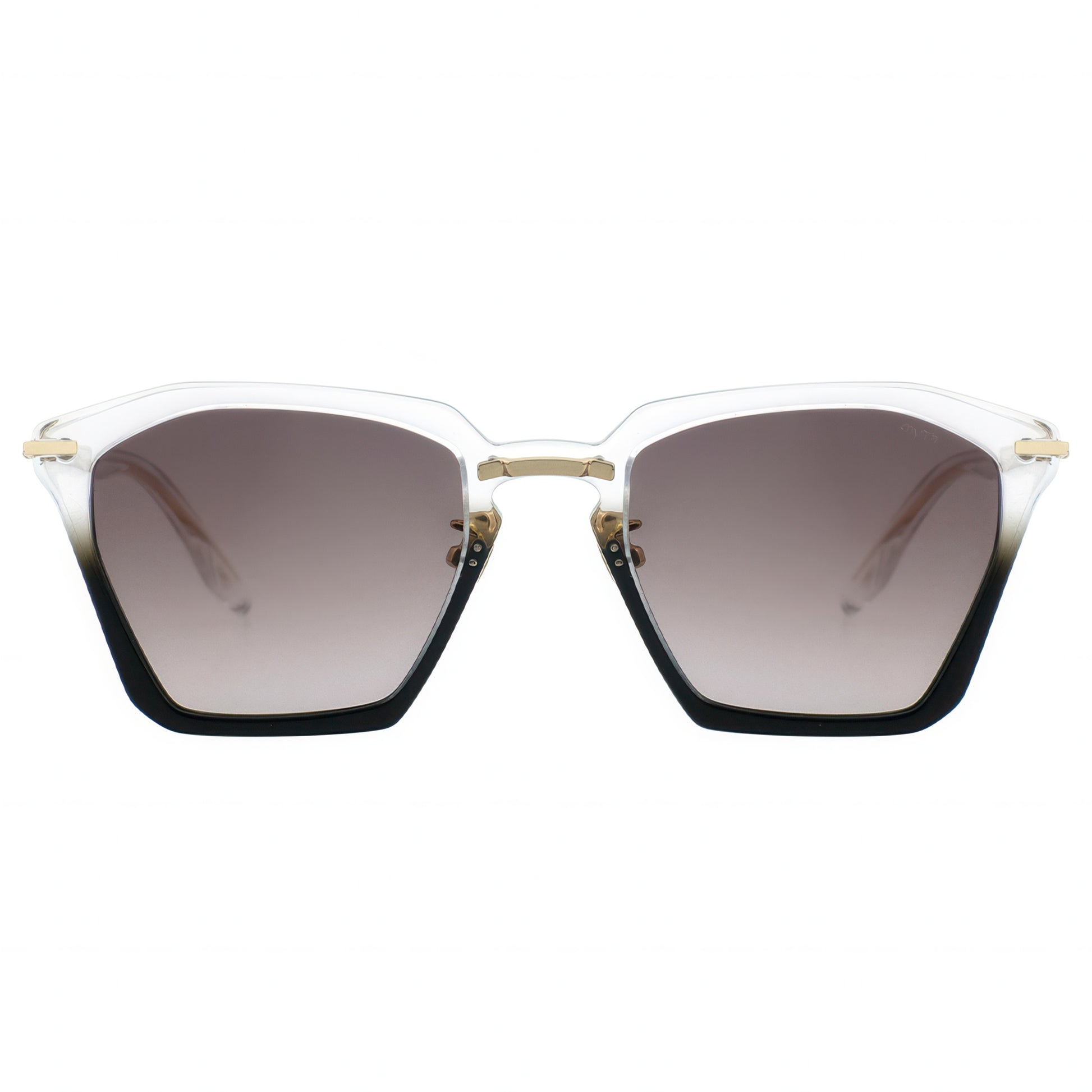 Translucent hexagonal cat-eye sunglasses with gradient brown lenses fading to clear, black bottom edges, and gold-tone metal accents on the temples.