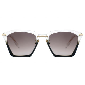 Translucent hexagonal cat-eye sunglasses with gradient brown lenses fading to clear, black bottom edges, and gold-tone metal accents on the temples.