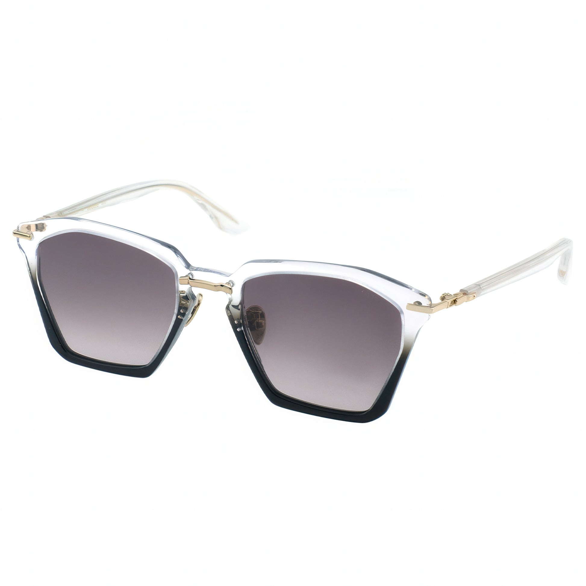 Side view of translucent crystal-clear acetate cat-eye sunglasses with hexagonal frames, gradient gray lenses fading from dark to light, black bottom edges, and gold-tone metal accents on the twisting temples.