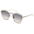 Sunglasses with gold frame and gradient lenses on a white background