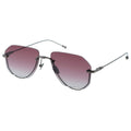 Sunglasses with pink gradient lenses and thin metal frame on a white background