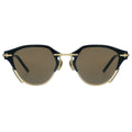 Sunglasses with black and gold frame on a white background