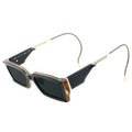 Sunglasses with black lenses and gold frames on a white background