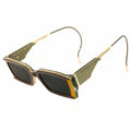 Sunglasses with gold and green frame on a white background