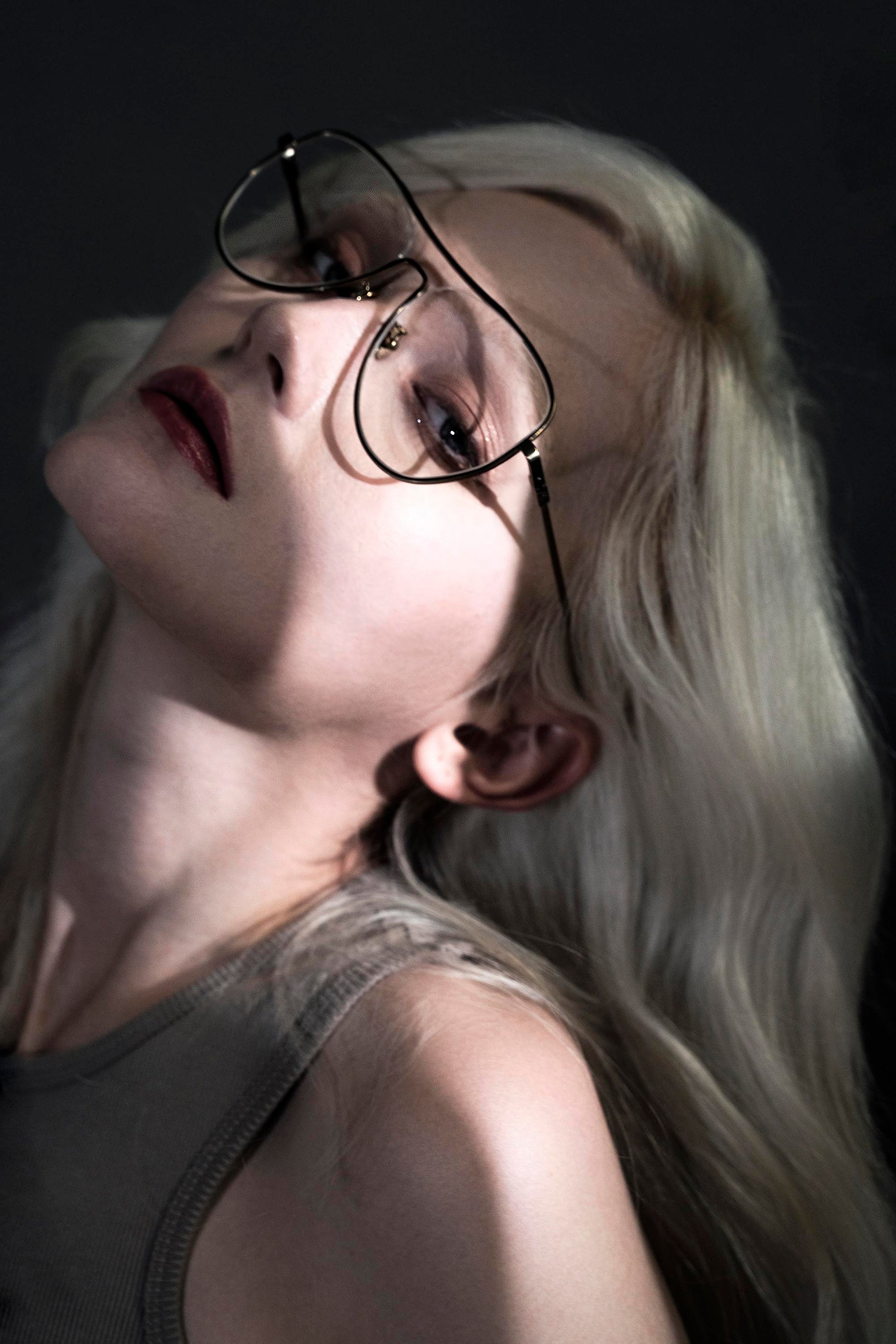 A model wears AIKTON eyeglasses