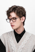A man wearing Transparent grey acetate spectacle frame, d-frame gold eyeglasses