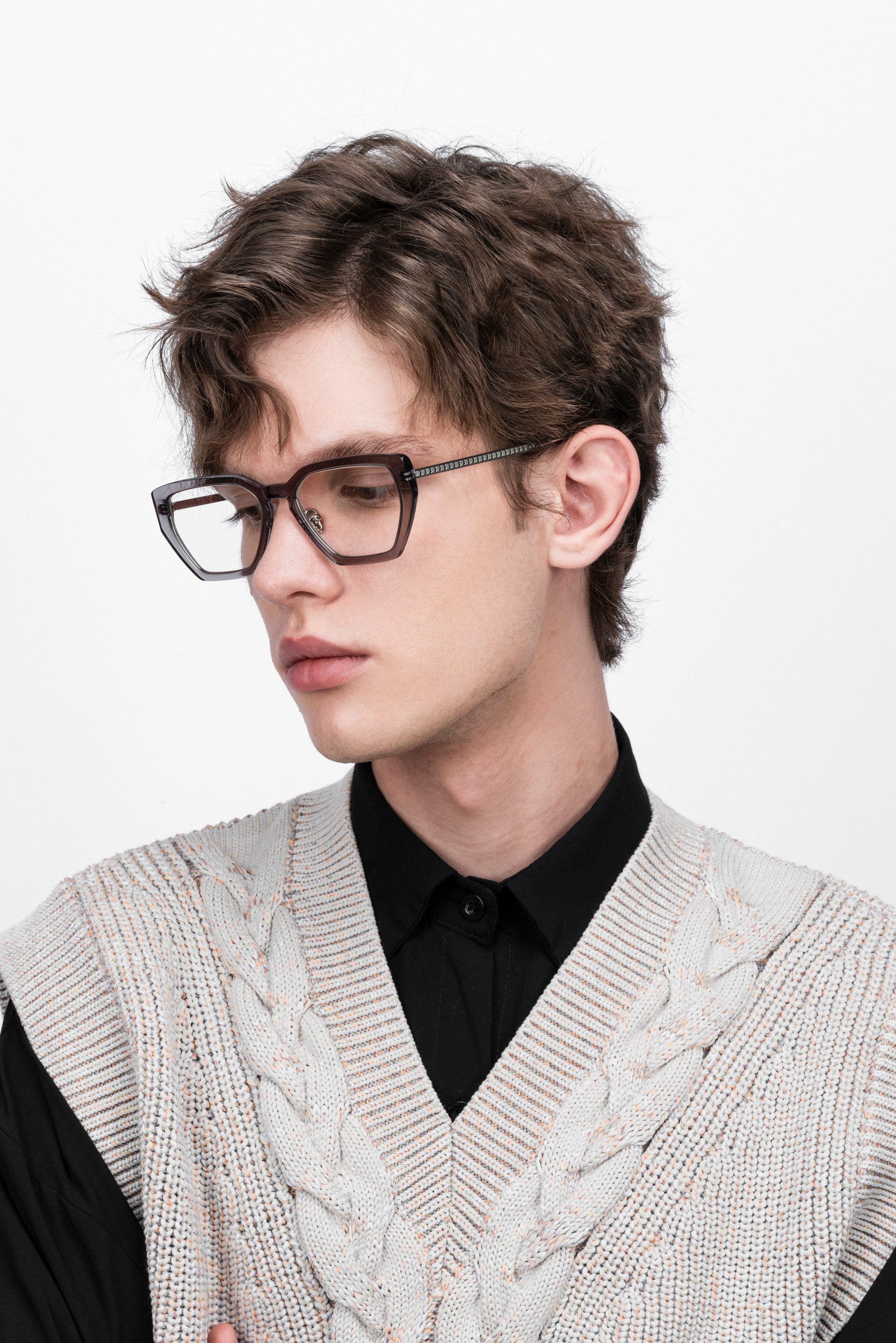 A man wearing Transparent grey acetate spectacle frame, d-frame gold eyeglasses